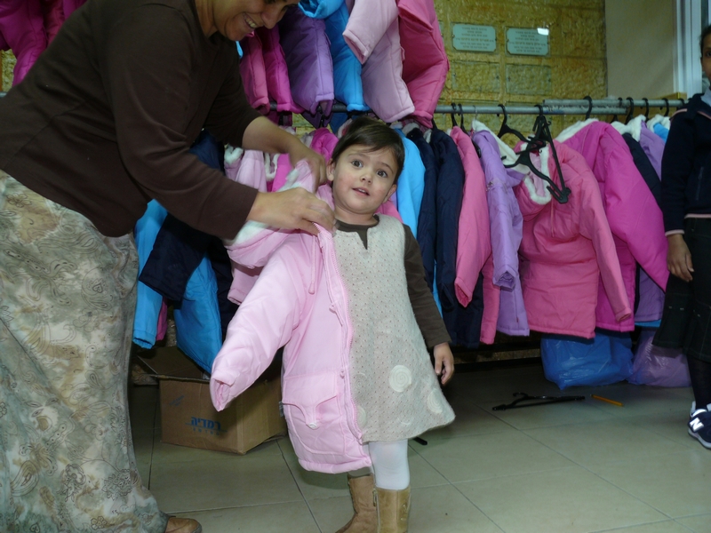 Getting fitted for her new winter coat!